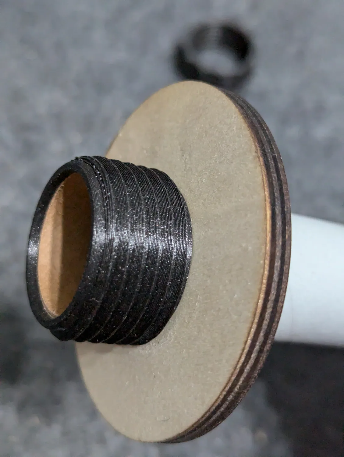 Motor retainer on the tube with the aft ring pushed up against it.