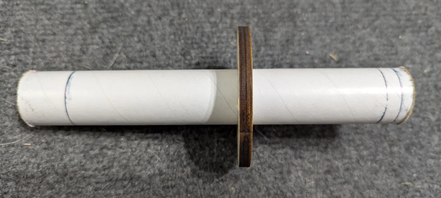 Aft ring parked mid-tube, forward ring removed.