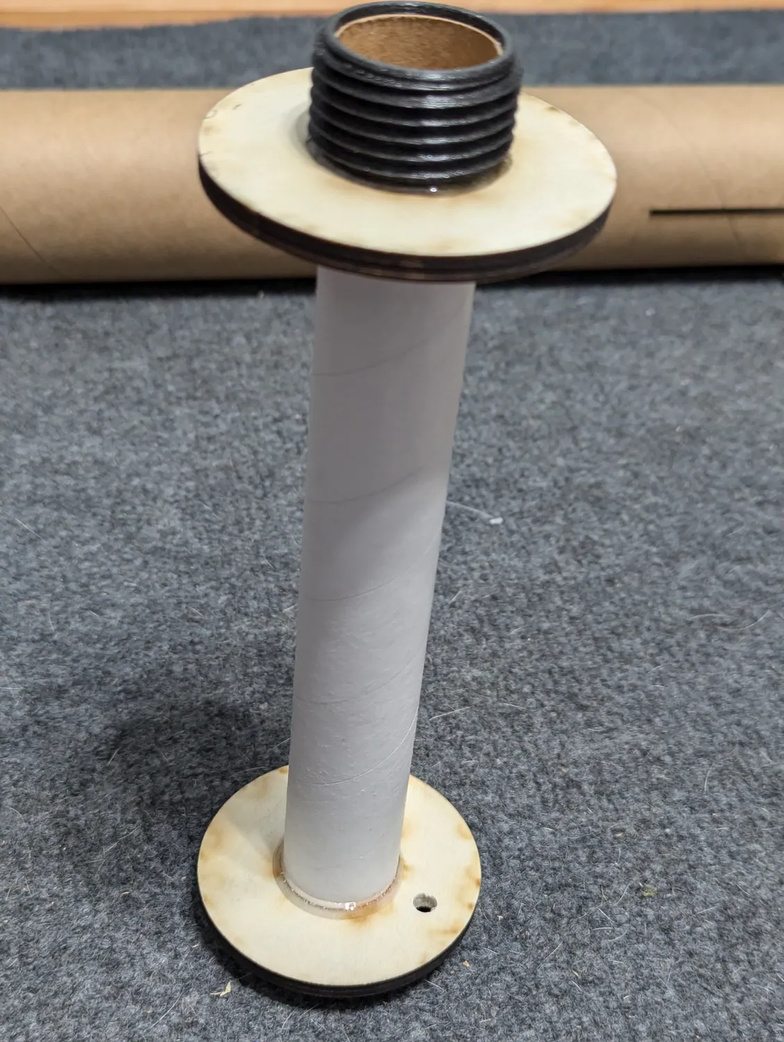 Motor mount standing on the forward ring while it cures.
