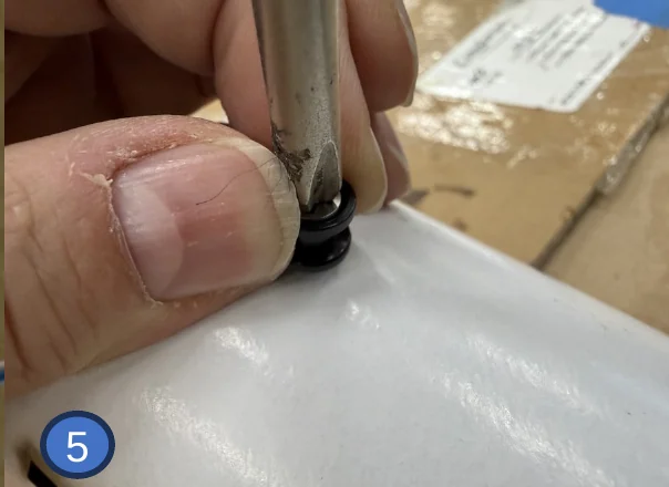 5 — Start the screw by hand, then pull the button outward as you tighten.