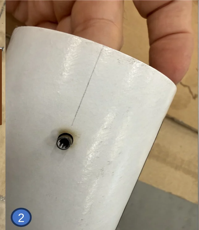 2 — Nut pressed into the hole from inside and held there.