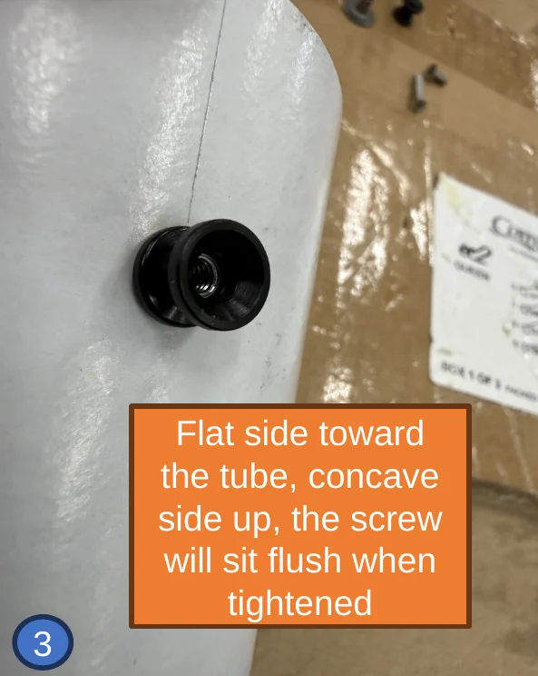 3 — Rail button on: flat side toward the tube, concave side up, so the screw sits flush.