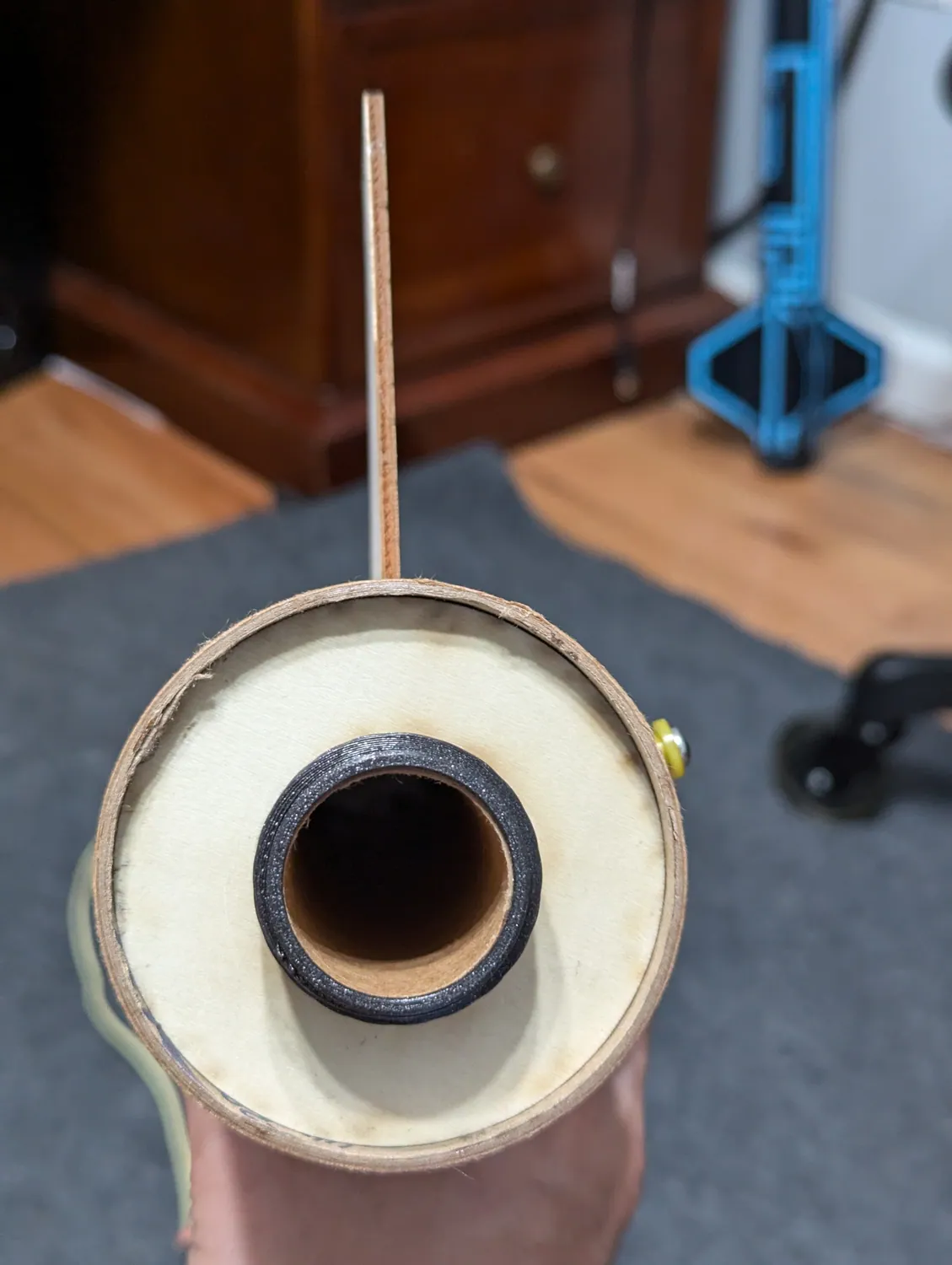 Fin standing straight out, root down on the motor mount.