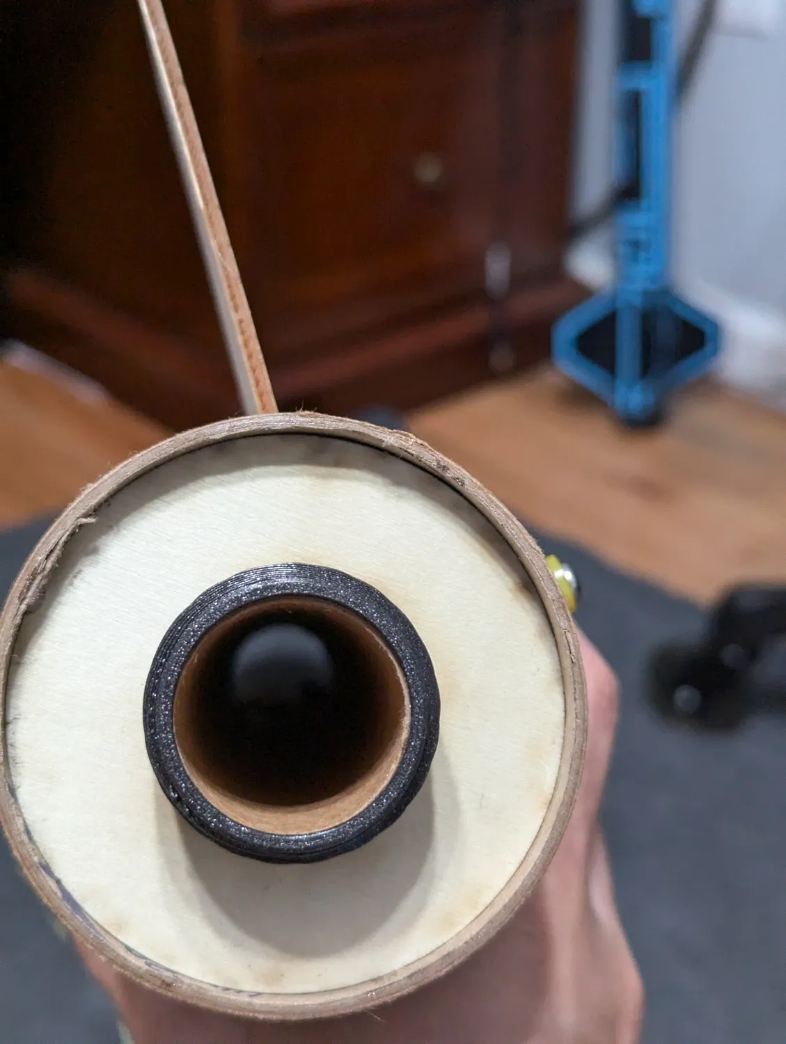 Fin canted in the slot — pull it and reset before it cures.